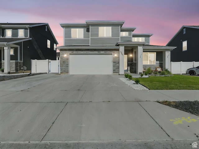 3287 S Boots Way, Syracuse, UT 84075 - view of front of house featuring stone siding, concrete driveway, and an attached garage