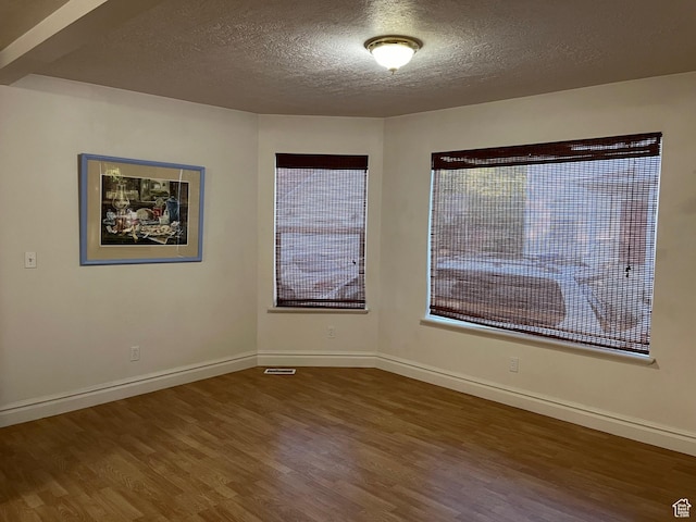 632 W 200 N, Salt Lake City, UT 84116 - empty room featuring wood finished floors and a textured ceiling