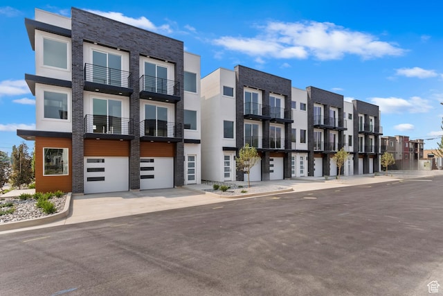 36 W 400 S, Bountiful, UT 84010 - view of building exterior featuring a residential view, driveway, and an attached garage