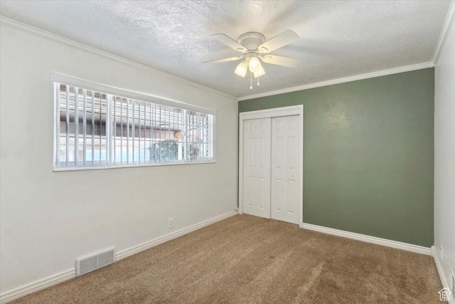 920 N 200 W, Bountiful, UT 84010 - unfurnished bedroom with carpet, a closet, ornamental molding, a textured ceiling, and baseboards