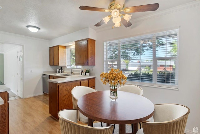 920 N 200 W, Bountiful, UT 84010 - kitchen with dishwasher, a sink, light countertops, brown cabinetry, and healthy amount of natural light