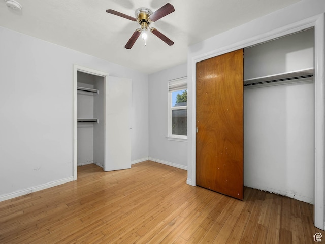 990 W 300 N, Provo, UT 84601 - unfurnished bedroom with light wood-style floors, ceiling fan, baseboards, and multiple closets