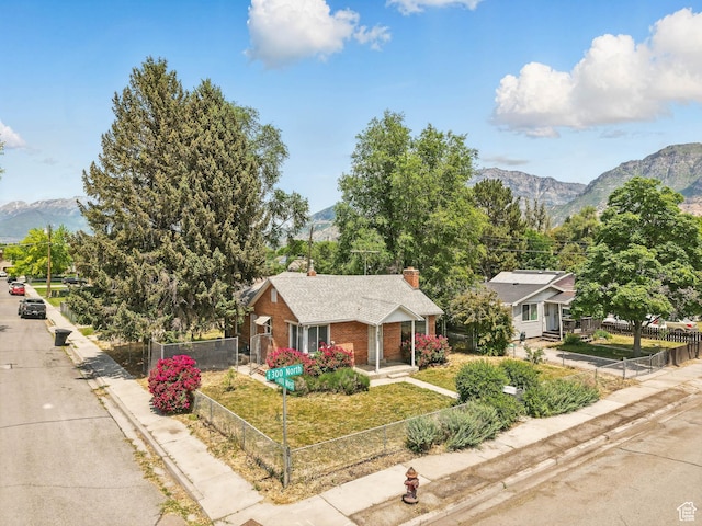 990 W 300 N, Provo, UT 84601 - single story home with a mountain view, brick siding, and a chimney