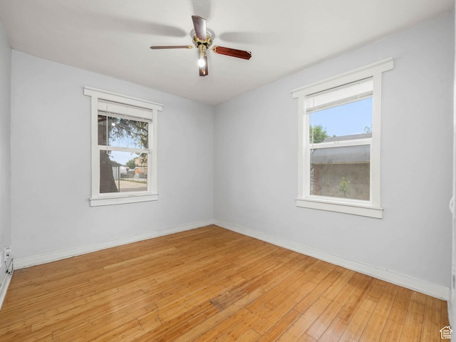 990 W 300 N, Provo, UT 84601 - spare room with plenty of natural light, light wood-type flooring, a ceiling fan, and baseboards