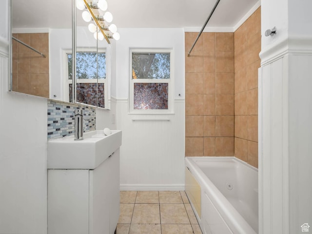 990 W 300 N, Provo, UT 84601 - bathroom featuring shower / tub combination, vanity, tile patterned flooring, decorative backsplash, and a wainscoted wall