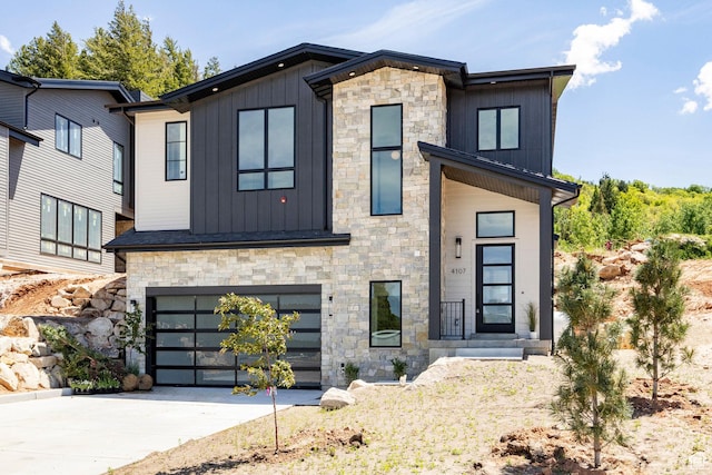 4107 W Crest Ct, Park City, UT 84098 - modern home with board and batten siding, stone siding, an attached garage, and driveway