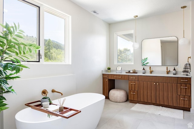 4107 W Crest Ct, Park City, UT 84098 - full bath with vanity, a freestanding bath, and plenty of natural light