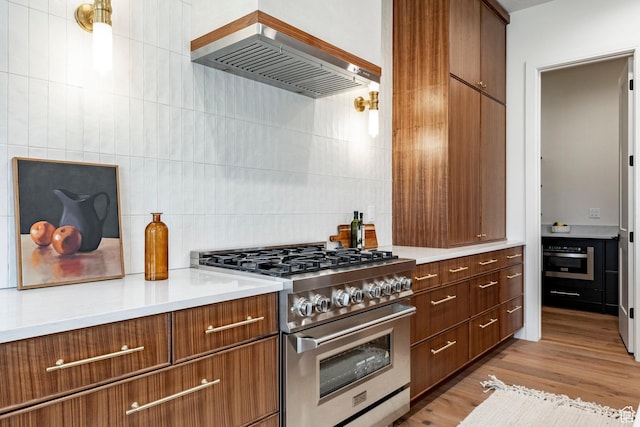4107 W Crest Ct, Park City, UT 84098 - kitchen featuring stainless steel appliances, wall chimney range hood, backsplash, and light countertops