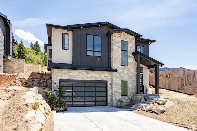 4107 W Crest Ct, Park City, UT 84098 - contemporary house featuring stone siding, driveway, board and batten siding, and a garage