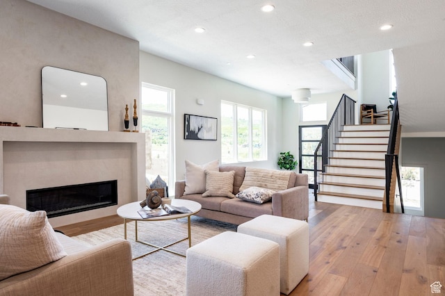 4107 W Crest Ct, Park City, UT 84098 - living area featuring hardwood / wood-style floors, recessed lighting, stairway, and a fireplace