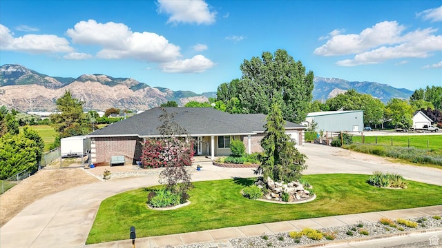 130 S 1500 W, Marriott Slaterville, UT 84404 - ranch-style home with curved driveway, a mountain view, and an attached garage