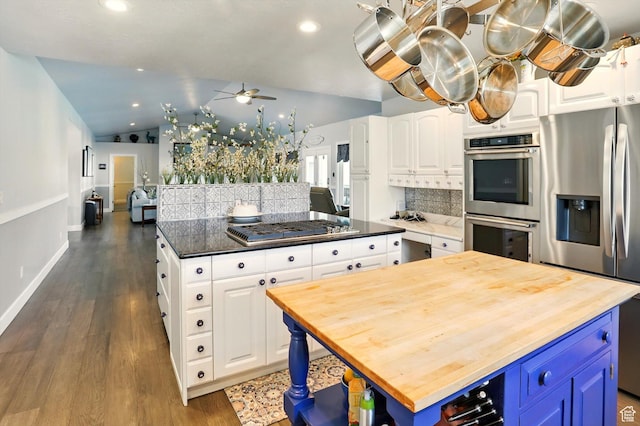 130 S 1500 W, Marriott Slaterville, UT 84404 - kitchen featuring a kitchen island, wood counters, appliances with stainless steel finishes, a ceiling fan, and backsplash