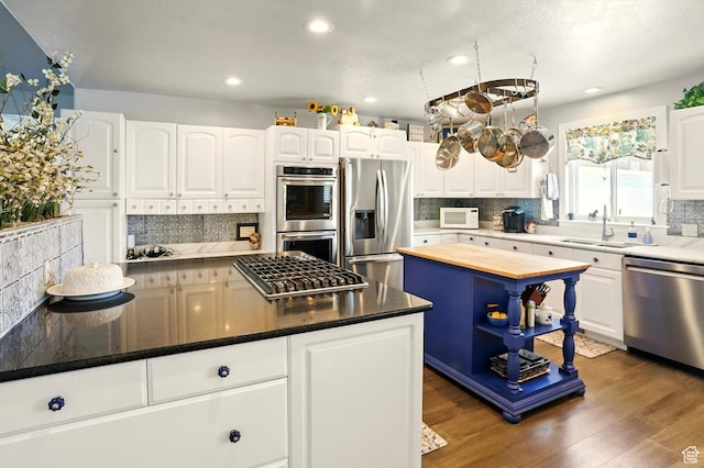 130 S 1500 W, Marriott Slaterville, UT 84404 - kitchen with stainless steel appliances, a sink, decorative backsplash, and recessed lighting