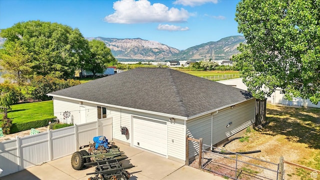 130 S 1500 W, Marriott Slaterville, UT 84404 - garage featuring driveway and a mountain view