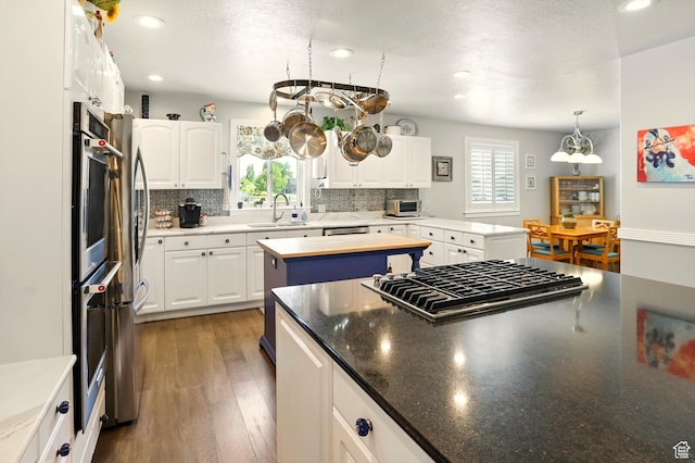 130 S 1500 W, Marriott Slaterville, UT 84404 - kitchen featuring a sink, appliances with stainless steel finishes, decorative backsplash, white cabinets, and recessed lighting