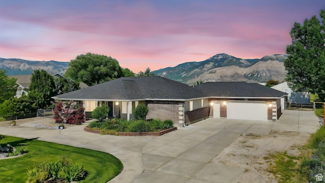 130 S 1500 W, Marriott Slaterville, UT 84404 - view of front of property featuring concrete driveway, a garage, a mountain view, and brick siding