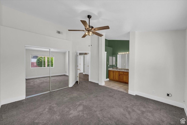 2461 W 1050 N, Hurricane, UT 84737 - unfurnished bedroom with carpet floors, baseboards, a closet, and a towering ceiling