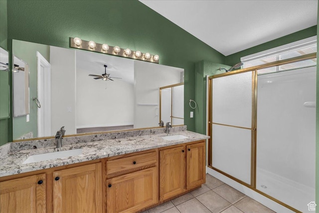 2461 W 1050 N, Hurricane, UT 84737 - full bathroom featuring a shower stall, double vanity, tile patterned flooring, ceiling fan, and vaulted ceiling