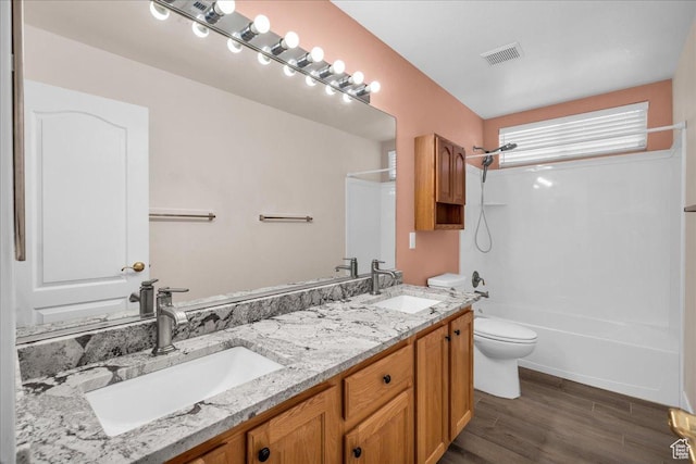 2461 W 1050 N, Hurricane, UT 84737 - bathroom with toilet, double vanity, wood finished floors, and shower / tub combination