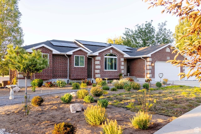 964 W Vahe St, Draper, UT 84020 - ranch-style home featuring brick siding, a garage, solar panels, and roof with shingles