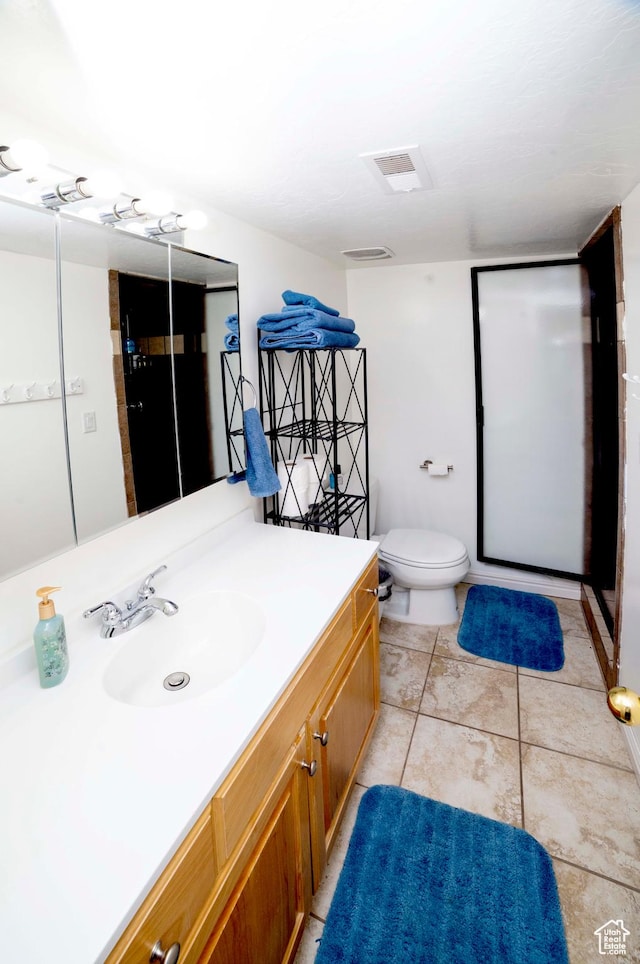 964 W Vahe St, Draper, UT 84020 - bathroom featuring vanity, toilet, and tile patterned flooring
