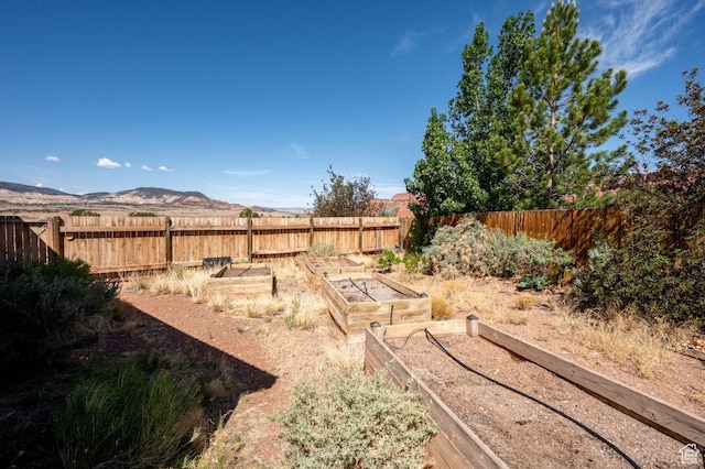 397 N Wendy Dr, Torrey, UT 84775 - fenced backyard featuring a garden