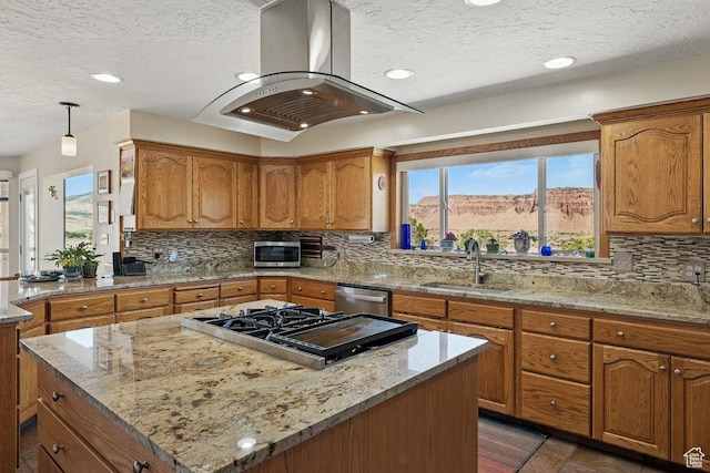 397 N Wendy Dr, Torrey, UT 84775 - kitchen featuring a sink, appliances with stainless steel finishes, island exhaust hood, a textured ceiling, and brown cabinetry