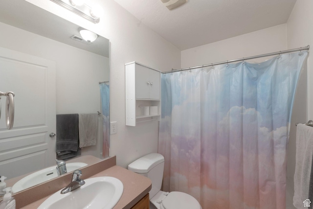 373 S State St Unit 10, Provo, UT 84606 - full bath featuring vanity, toilet, and a shower with curtain