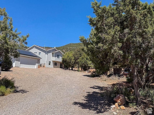 425 E Mule Deer Rd, Central, UT 84722 - view of front of property with an outdoor structure and gravel driveway