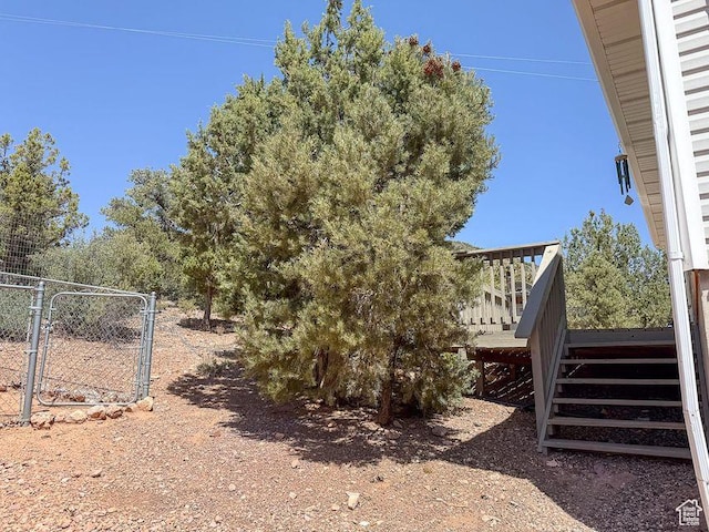 425 E Mule Deer Rd, Central, UT 84722 - view of yard with a wooden deck, stairway, and a gate