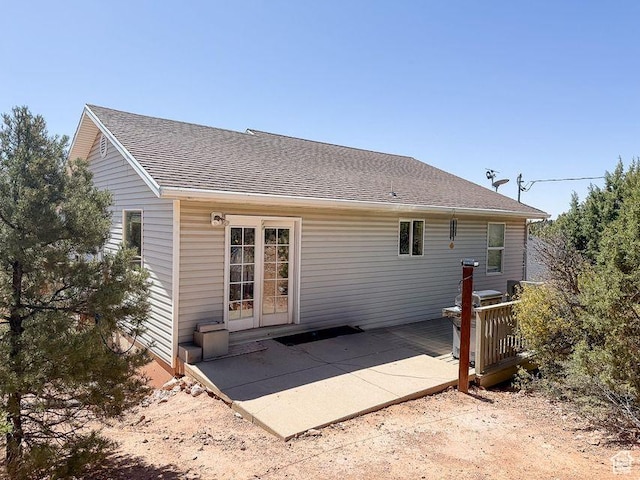 425 E Mule Deer Rd, Central, UT 84722 - back of house featuring roof with shingles, a patio, and a wooden deck