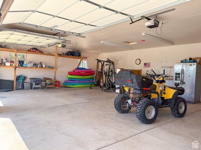 425 E Mule Deer Rd, Central, UT 84722 - garage featuring stainless steel fridge and a garage door opener