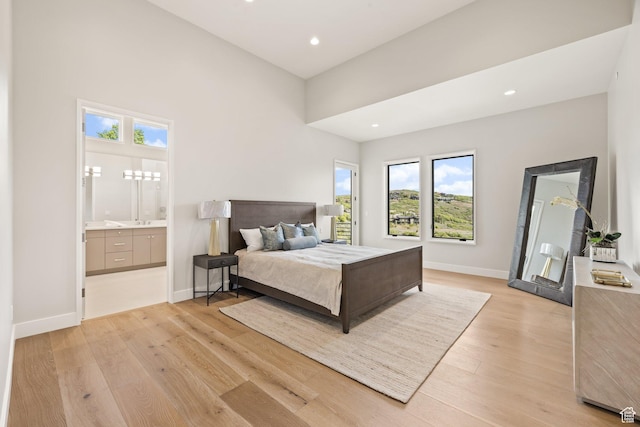 3654 Aspen Camp Loop, Park City, UT 84098 - bedroom with multiple windows, light wood-style flooring, baseboards, recessed lighting, and connected bathroom