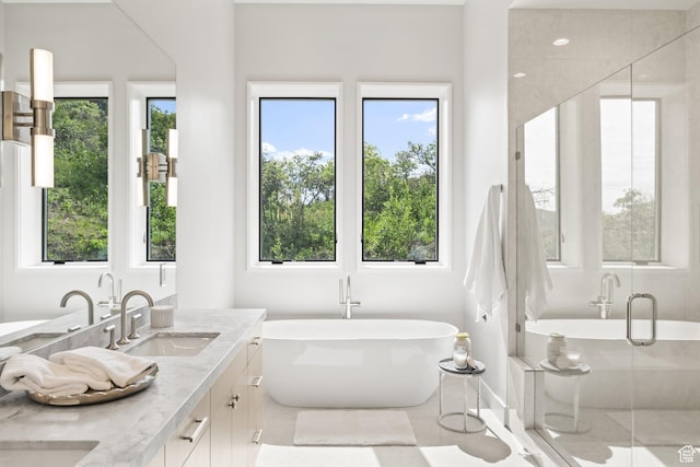 3654 Aspen Camp Loop, Park City, UT 84098 - full bathroom with double vanity, a freestanding bath, healthy amount of natural light, and a stall shower
