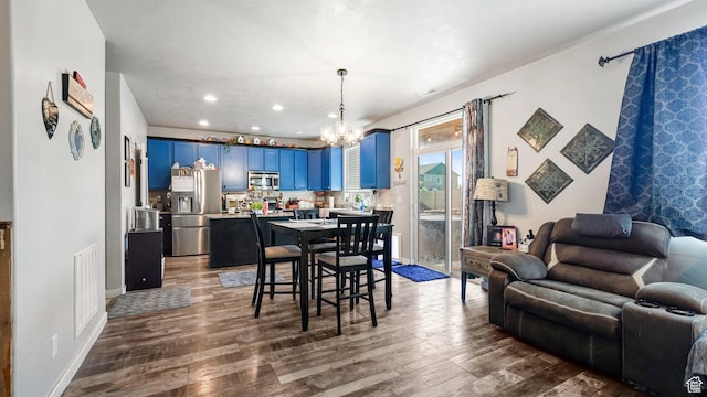 1002 W Stonehaven Dr Unit 108, North Salt Lake, UT 84054 - dining space featuring a chandelier, wood finished floors, and recessed lighting
