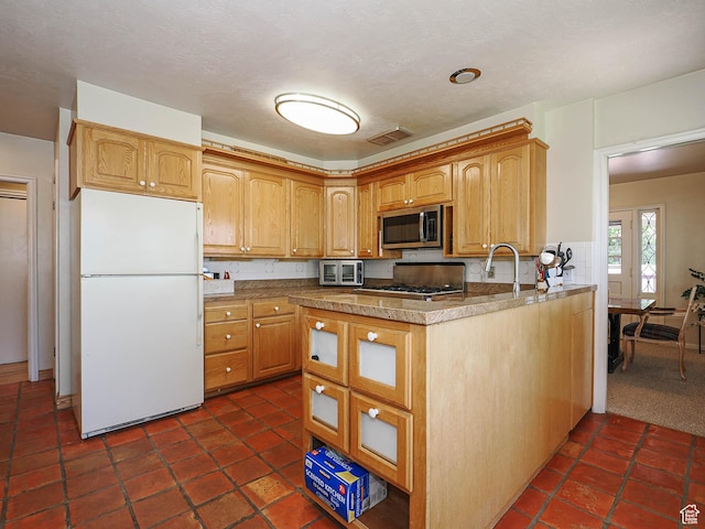 2244 E Laird Way, Salt Lake City, UT 84108 - kitchen featuring freestanding refrigerator, stainless steel microwave, and range