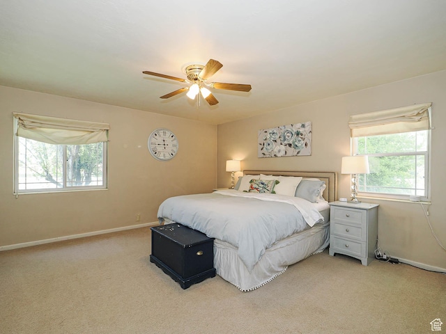 2244 E Laird Way, Salt Lake City, UT 84108 - bedroom with light carpet, multiple windows, and baseboards