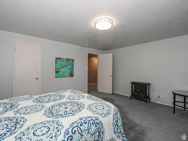 2244 E Laird Way, Salt Lake City, UT 84108 - bedroom with a wood stove and carpet flooring