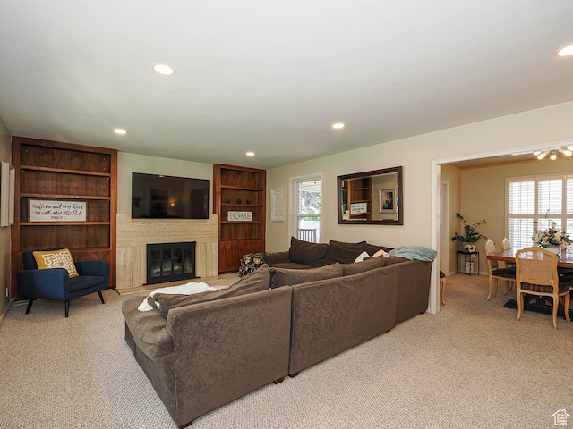 2244 E Laird Way, Salt Lake City, UT 84108 - living area featuring light colored carpet, a glass covered fireplace, and recessed lighting