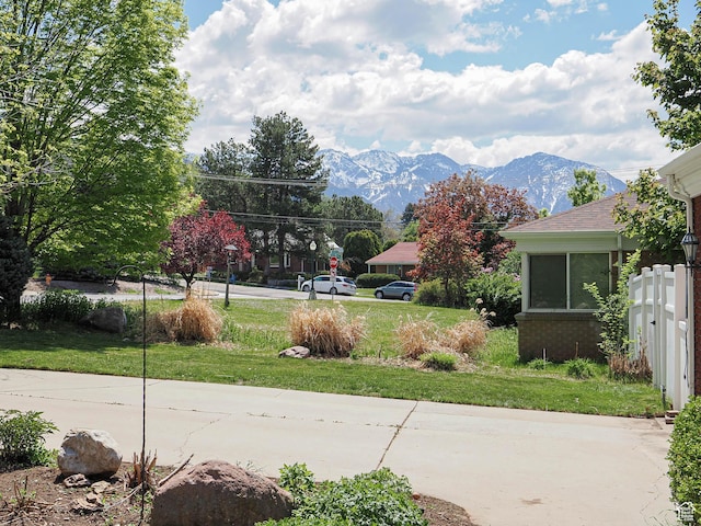 2244 E Laird Way, Salt Lake City, UT 84108 - view of concrete road with a mountain view and street lighting