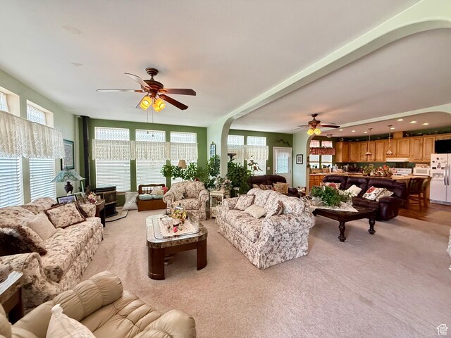 2780 S Bunch Grass Dr Unit 16, Garden City, UT 84028 - living area featuring ceiling fan, arched walkways, light carpet, and recessed lighting