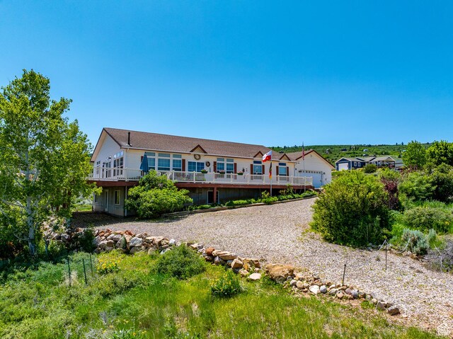 2780 S Bunch Grass Dr Unit 16, Garden City, UT 84028 - view of front facade featuring a wooden deck