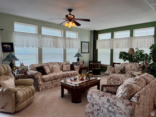 2780 S Bunch Grass Dr Unit 16, Garden City, UT 84028 - carpeted living area featuring a wood stove and ceiling fan