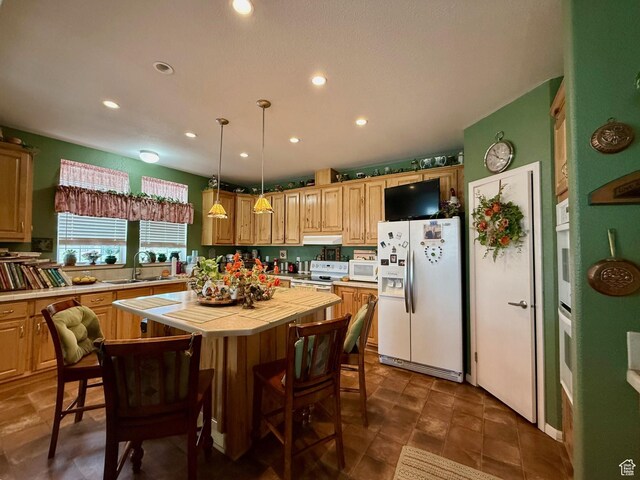 2780 S Bunch Grass Dr Unit 16, Garden City, UT 84028 - kitchen with white appliances, tile countertops, a sink, recessed lighting, and a center island