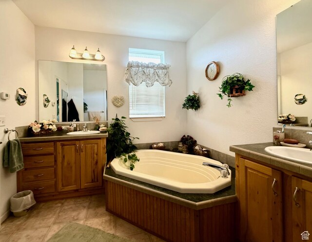 2780 S Bunch Grass Dr Unit 16, Garden City, UT 84028 - full bath featuring two vanities, a bath, and tile patterned flooring