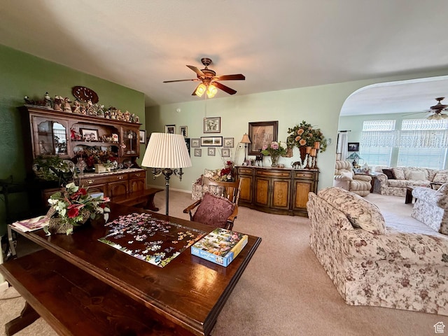 2780 S Bunch Grass Dr Unit 16, Garden City, UT 84028 - living area featuring ceiling fan, light carpet, and arched walkways