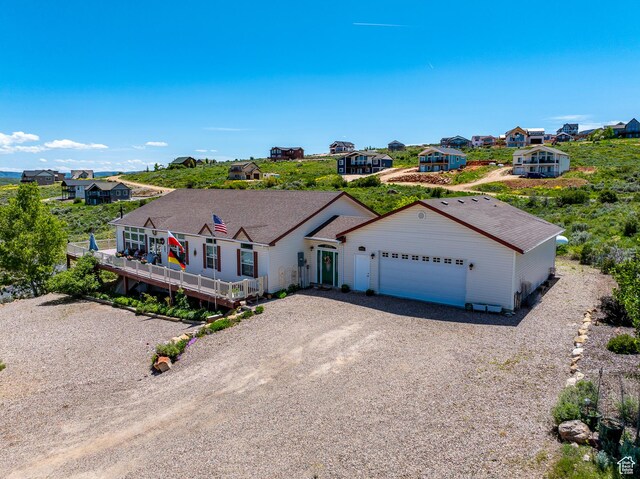 2780 S Bunch Grass Dr Unit 16, Garden City, UT 84028 - ranch-style house featuring driveway, a garage, and a residential view