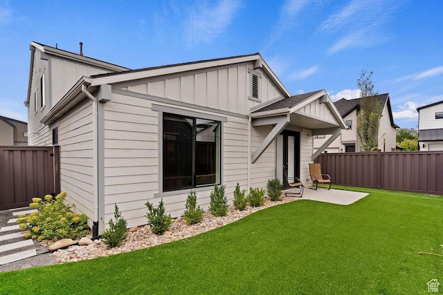 1494 W Lincoln Way, Kaysville, UT 84037 - rear view of property featuring board and batten siding and a patio area
