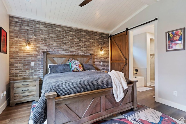 1494 W Lincoln Way, Kaysville, UT 84037 - bedroom featuring a barn door, baseboards, wood finished floors, vaulted ceiling, and brick wall