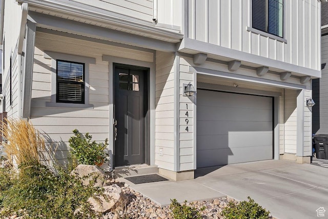 1494 W Lincoln Way, Kaysville, UT 84037 - property entrance featuring a garage and board and batten siding